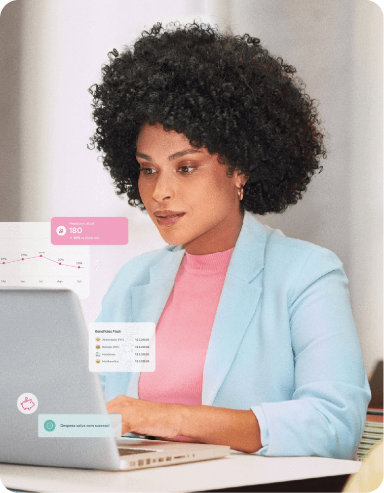 Profissional focada trabalhando em seu laptop em um escritório.